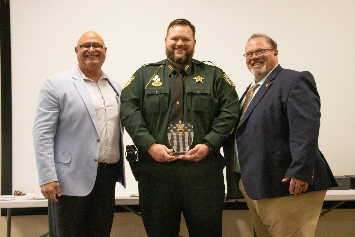 Ryane Ammons was selected Law Enforcement Officer of the Year. Pictured left to right are Major Michael Hazellief, Ryane Ammons and Sheriff Noel Stephen.